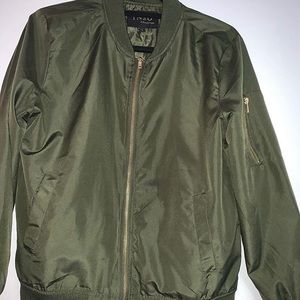 Green windbreaker size L.